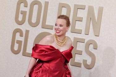 Alma-Pysti-shiny-red-satin-off-shoulder-rom-gown-apt-the-2024-Golden-Globes.jpg