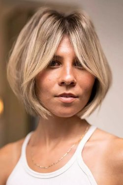 تسريحة Sun-Kissed Bob with Curtain Bangs.jpg