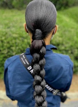 تسريحة Slicked back and braided low ponytail.jpg