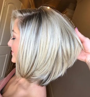 تسريحة Perfect Layered Blonde Bob with Bangs.jpg