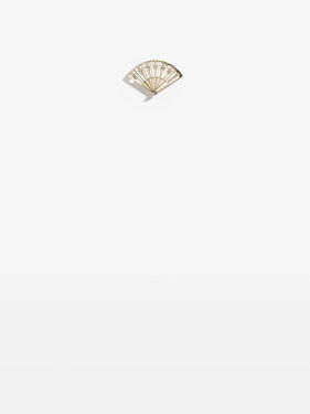 chanel brooch in metal and gold.jpeg