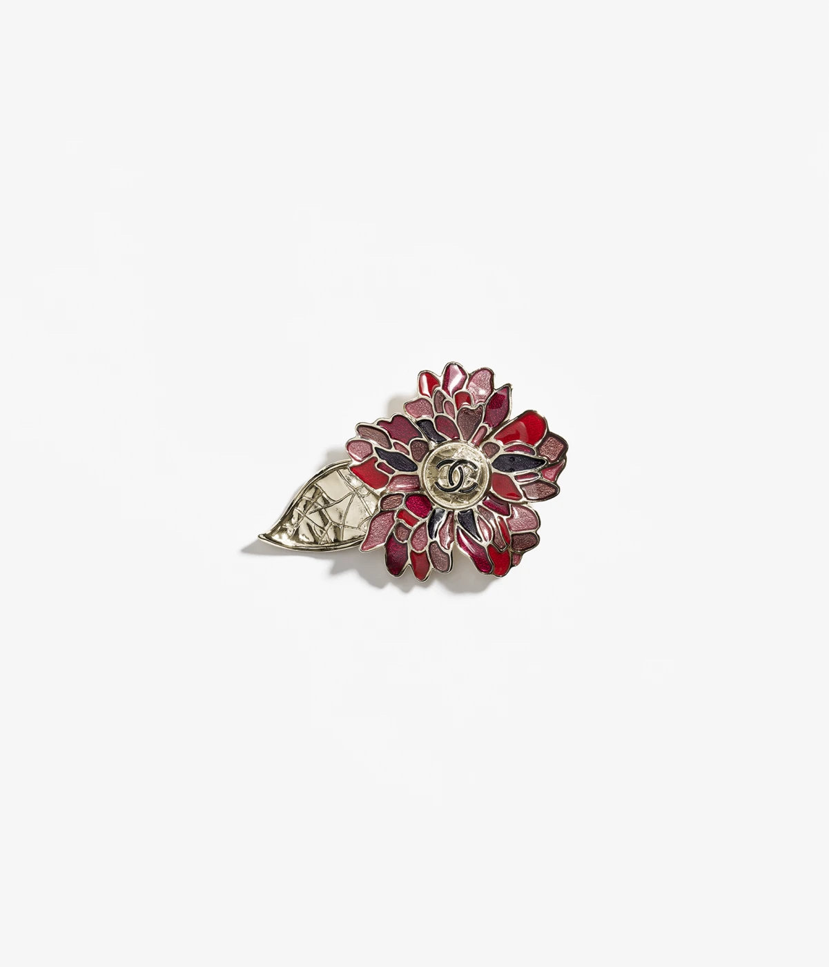 chanel brooch in metal and resin.jpeg