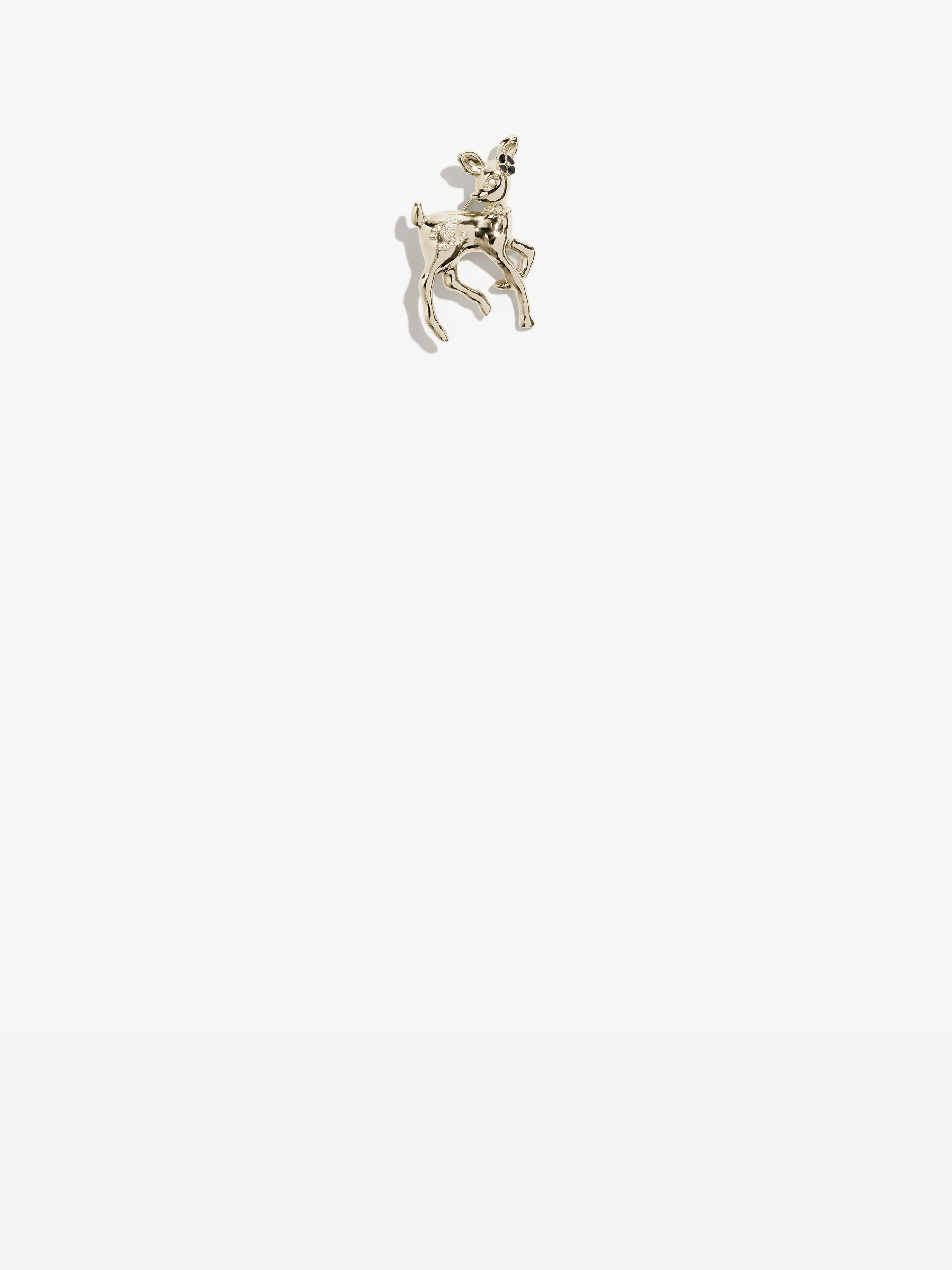chanel brooch in metal glass pearls ressin strass and crystals.jpeg