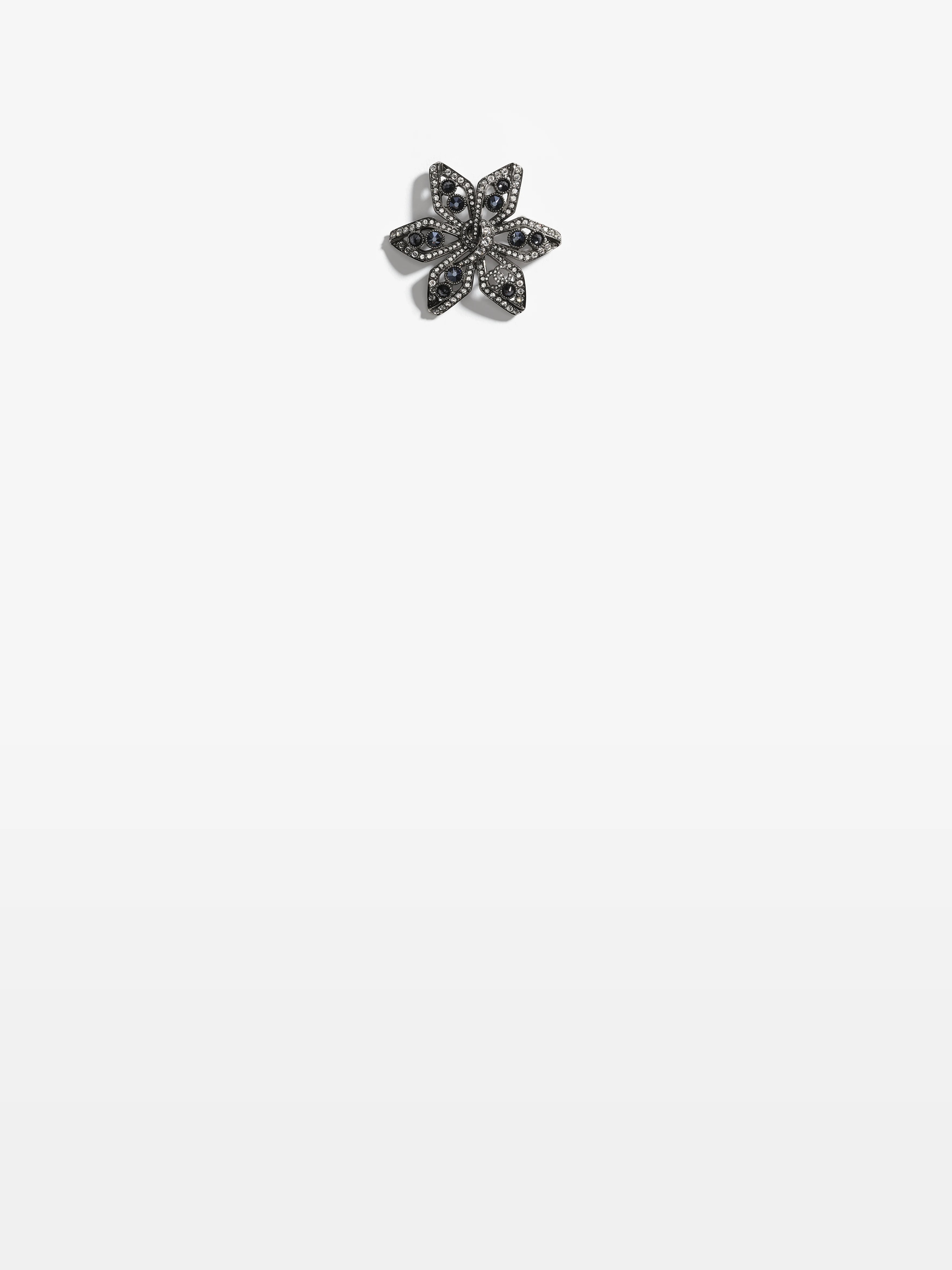 chanel brooch in metal strass and crystal.jpeg